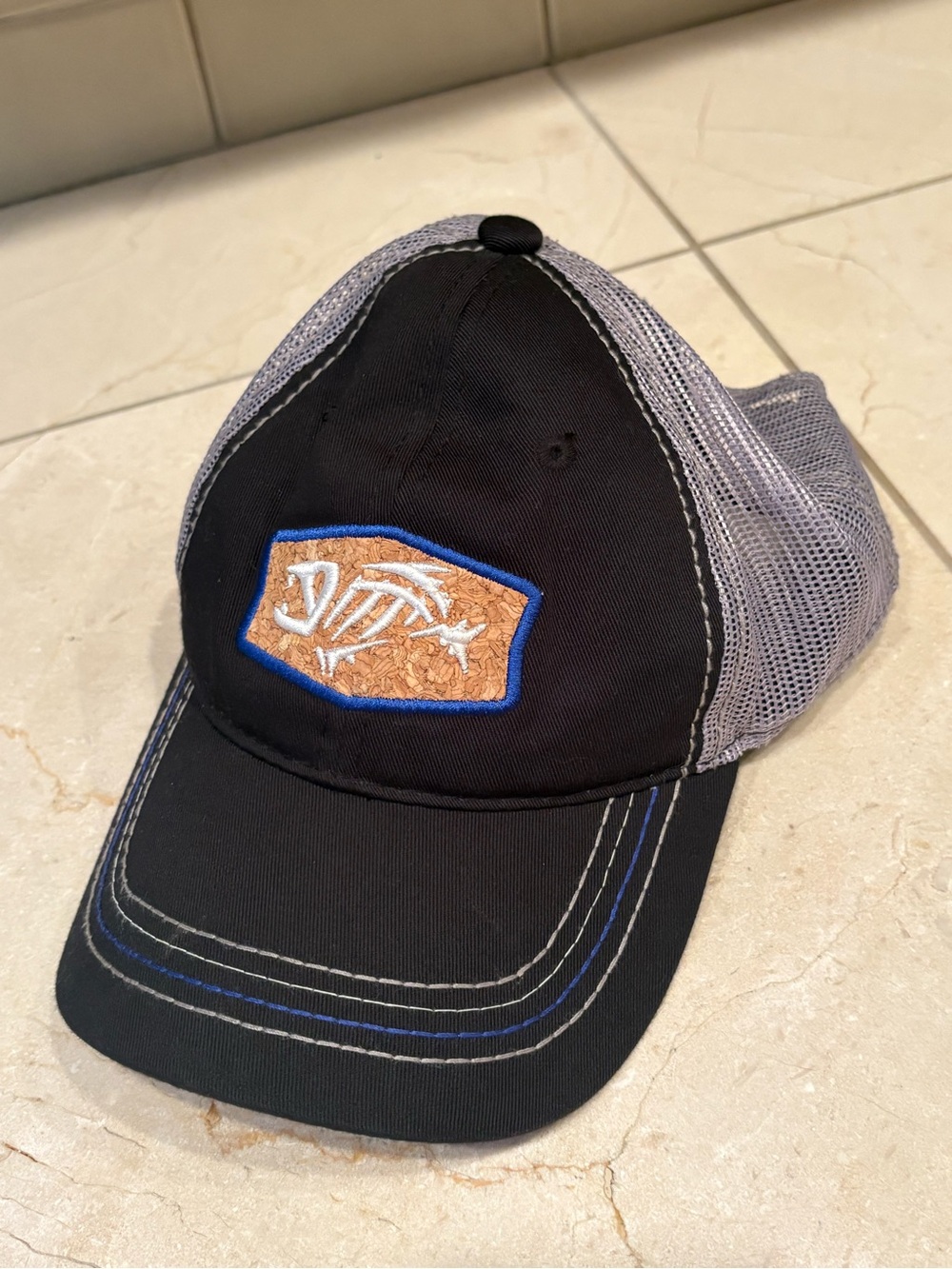 G Loomis | Men's Black and Gray Trucker Hat with Cork Fish Patch Logo | One Size